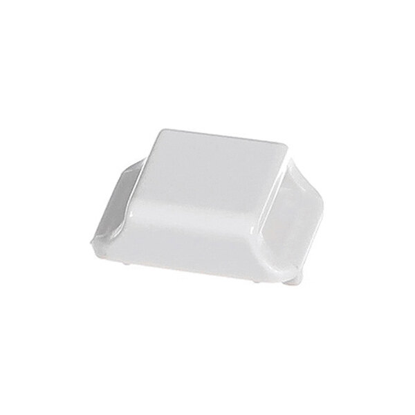 A small, white, rectangular plastic knob with slightly raised sides and rounded edges.