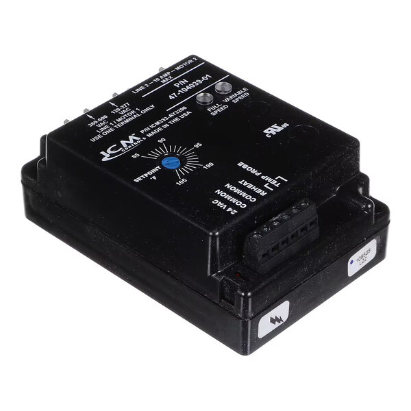 A black rectangular electronic control module with labeled connection ports, adjustment dial, and indicator lights on its surface.