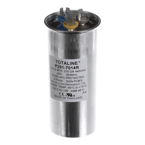 A cylindrical metallic capacitor with three electrical terminals on top and a label displaying technical specifications.