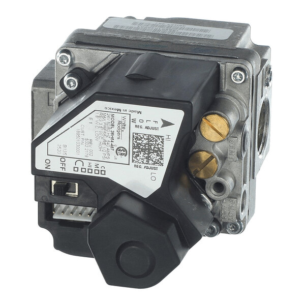 A metallic and plastic gas valve assembly with adjustment knobs, labeled settings, and connection ports visible.
