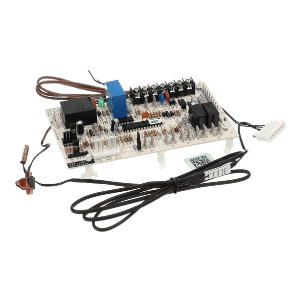 A rectangular electronic circuit board with various components, connectors, and attached wires, including sensors and a plug.