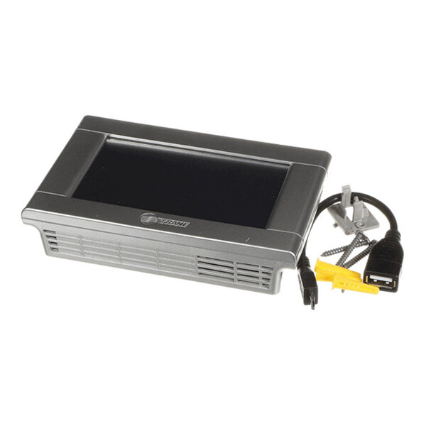 A rectangular electronic device with a black screen, vent-like openings on the front, and attached cables with connectors and mounting hardware visible beside it.