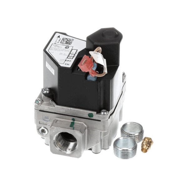 A metallic gas valve with a black plastic top, accompanied by two threaded metal fittings and a brass fitting, all placed on a white background.