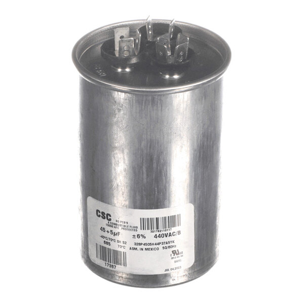 A cylindrical metal component with two sets of electrical terminals on top and a label with technical specifications on the side.