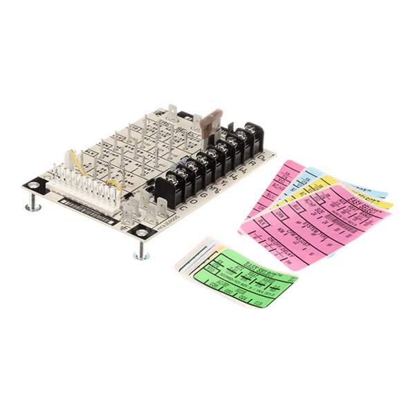A rectangular electronic control board with multiple connectors, terminals, and a fuse, accompanied by several colorful adhesive labels.