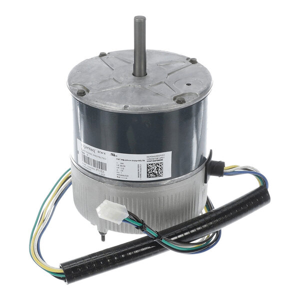 A cylindrical electric motor with a central shaft, attached wires, and a label with technical information.