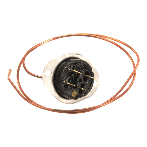 A round black and silver component with a coiled copper wire attached, featuring multiple metal terminals and mounting holes.