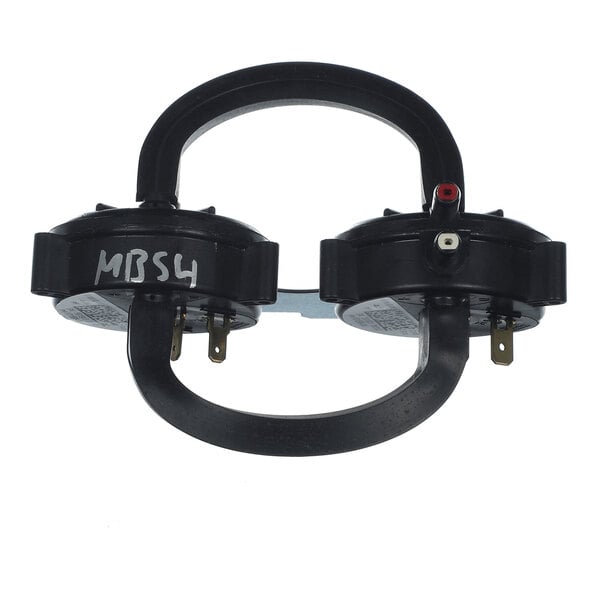 A dual black circular device with two U-shaped tubes and several metal connectors, labeled 'MBS4' on one side.