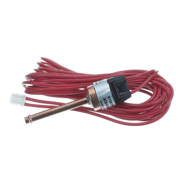 A cylindrical metal and plastic switch with a long red electrical wire coiled around it and a white connector at the end.