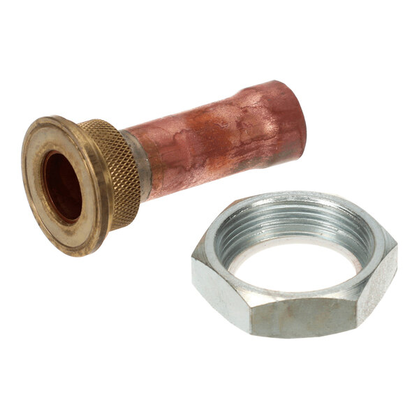 A metal valve component with a copper body and brass fitting, accompanied by a large hexagonal metal nut, both placed on a white background.