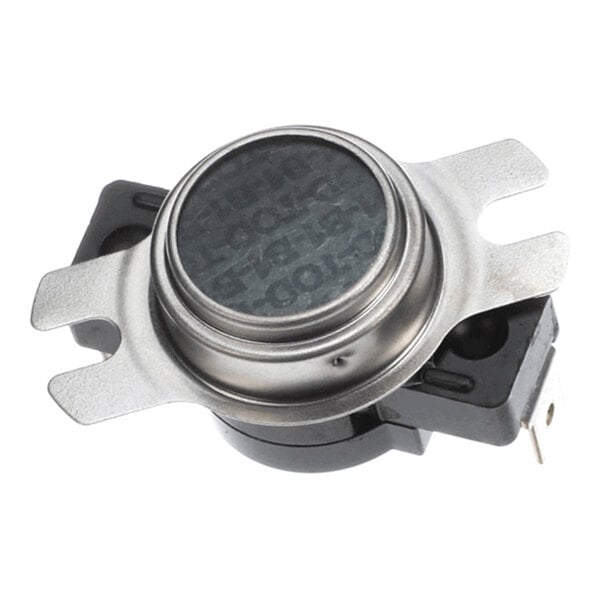A close-up view of a metallic and plastic electronic component with mounting brackets and electrical terminals.