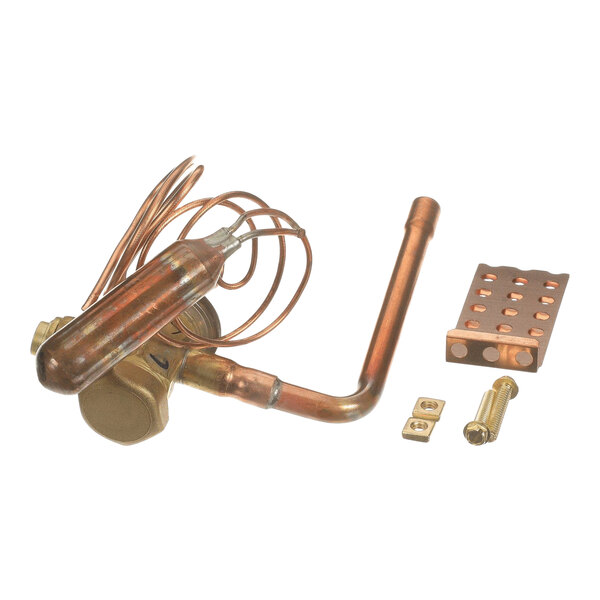 A set of copper and brass mechanical components, including a coiled tube, a valve, and several small fittings, arranged on a white background.