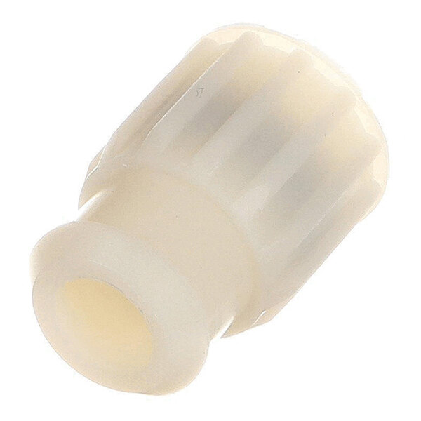 A cream-colored, cylindrical plastic or rubber component with a ridged exterior and a hollow center.