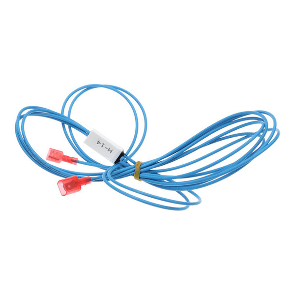 A blue electrical wire with two red connectors and a small white component attached, coiled and secured with a rubber band.