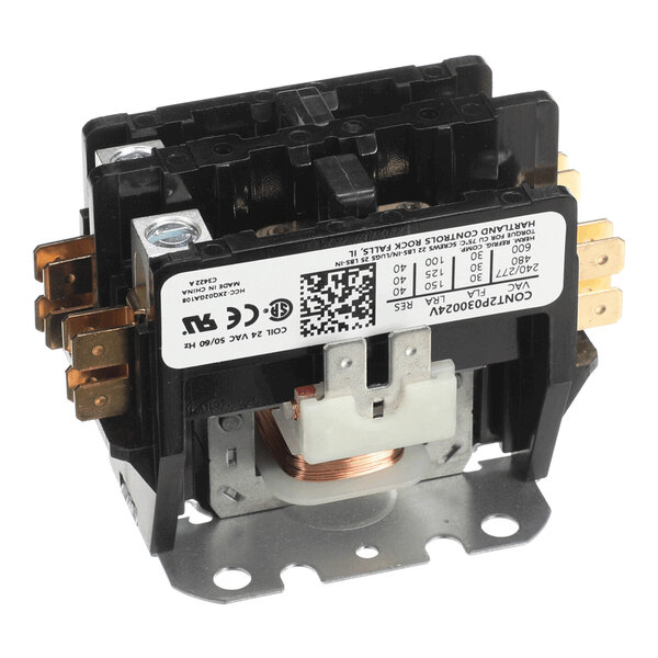 A black and metallic electrical component with multiple brass terminals and a visible copper coil, featuring a white label with technical specifications and a QR code.