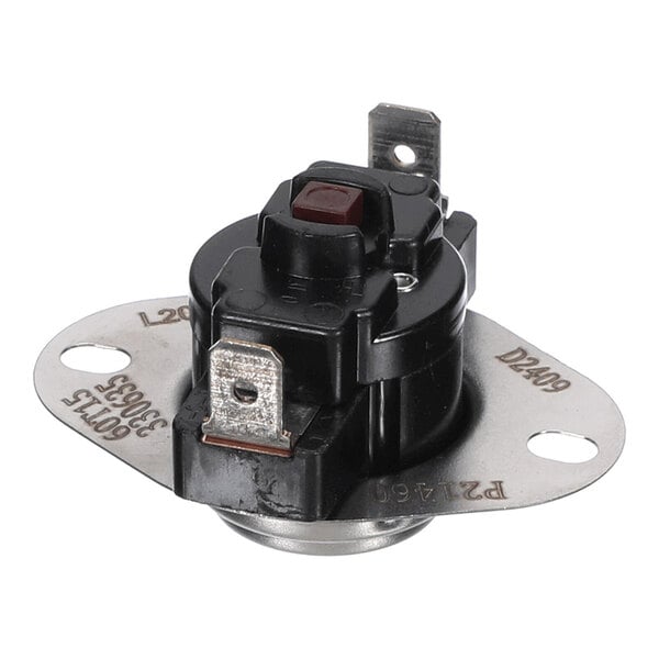 A close-up view of a small electronic component with a metal mounting plate, two terminal connectors, and a red button on top.