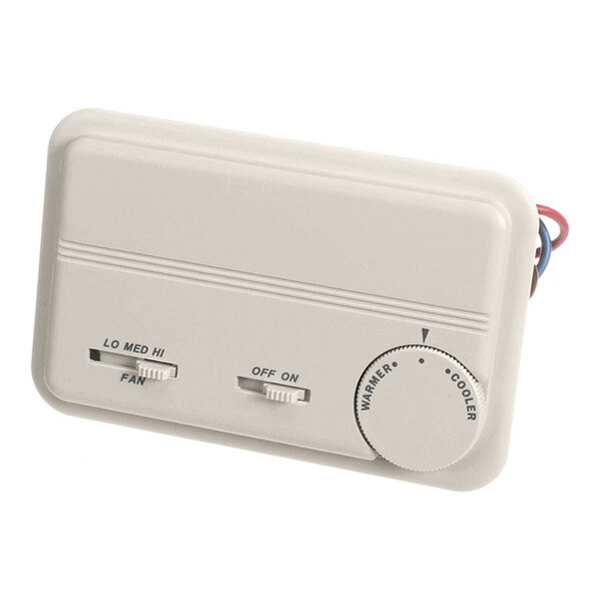 A beige rectangular thermostat with two sliding switches labeled 'FAN' and 'ON/OFF,' and a round dial for adjusting temperature between 'WARMER' and 'COOLER.'