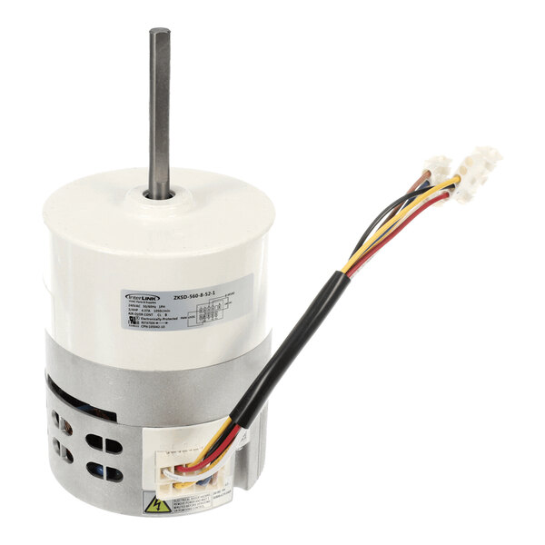 A cylindrical electric motor with a vertical shaft, attached wires, and a connector at the end.