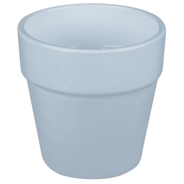 A gray cast aluminum round condiment bowl with a white interior and a white handle.