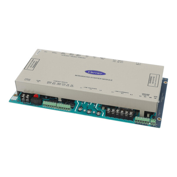 A rectangular electronic module with a metallic cover labeled 'Carrier Integrated Starter Module,' featuring various electrical terminals and connectors on a green circuit board base.