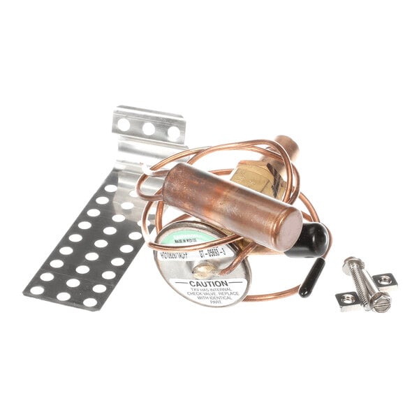 A collection of metal components including a coiled copper tube, a cylindrical valve, perforated metal brackets, and screws.