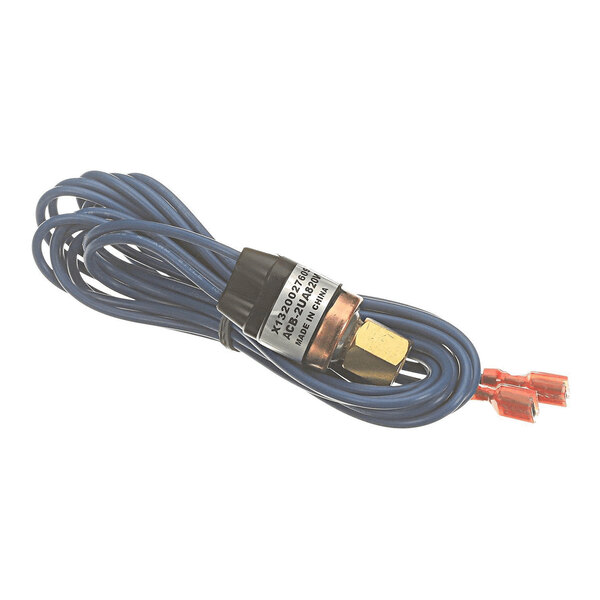 A coiled blue wire with a brass fitting and two red connectors at the end, attached to a cylindrical component with a label.