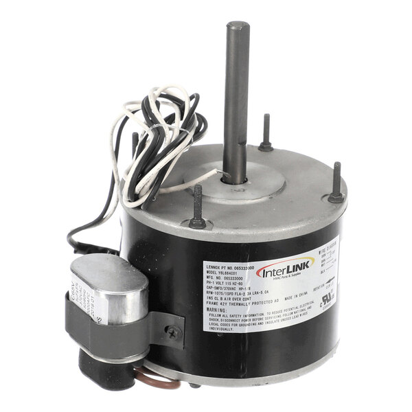 A cylindrical electric fan motor with attached wires, a central shaft, and a label displaying technical specifications.