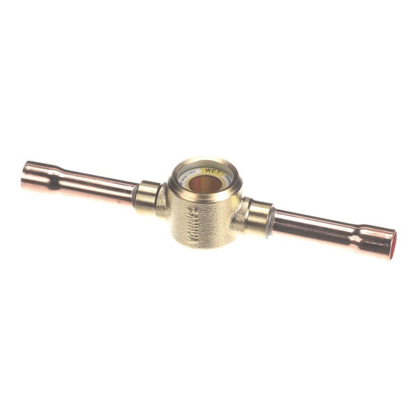 A brass and copper cylindrical plumbing component with a central glass viewing window and two pipe extensions on either side.