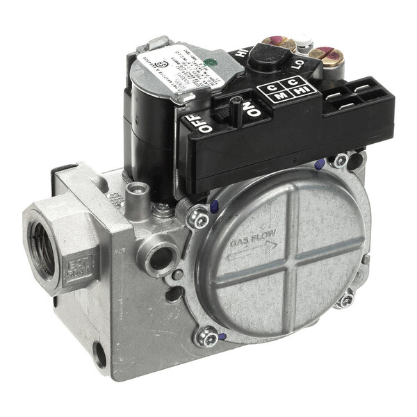 A metallic gas valve with a cylindrical body, multiple connection ports, and a black control module on top labeled with ON/OFF and other settings.