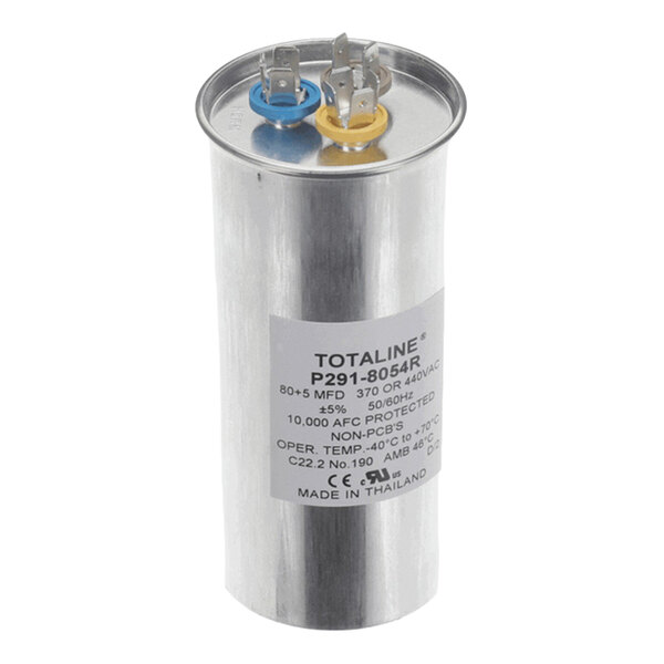 A cylindrical metallic capacitor with two labeled terminals on top, one with a blue ring and one with a yellow ring, and a product label on the side.