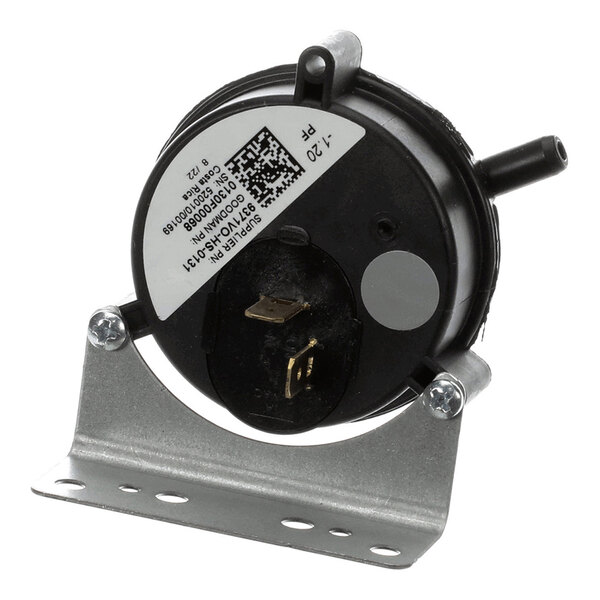 A round black pressure switch with a metal mounting bracket, two electrical terminals, and two hose connections.