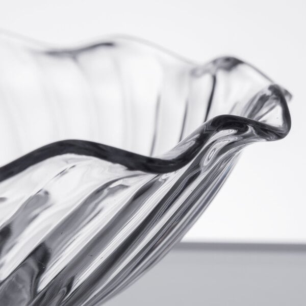 A Carlisle clear glass tulip berry dish.