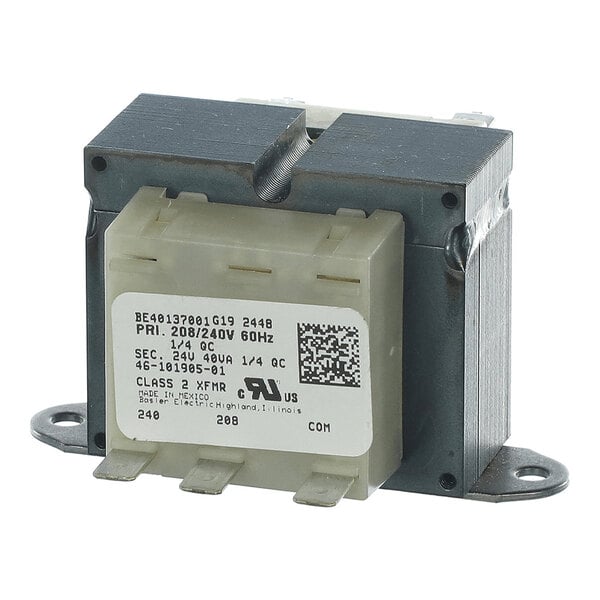 A metal and plastic electrical transformer with labeled terminals and a printed information label on the front.