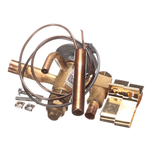 A collection of brass and copper mechanical parts, including tubes, fittings, a coiled wire, and metal brackets, arranged on a white background.