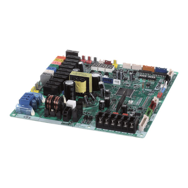 A green electronic circuit board with various capacitors, connectors, relays, and other electronic components mounted on it.