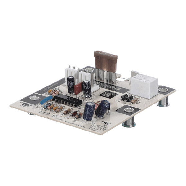 A small electronic circuit board with various components including capacitors, resistors, connectors, and an integrated circuit, mounted on standoffs.