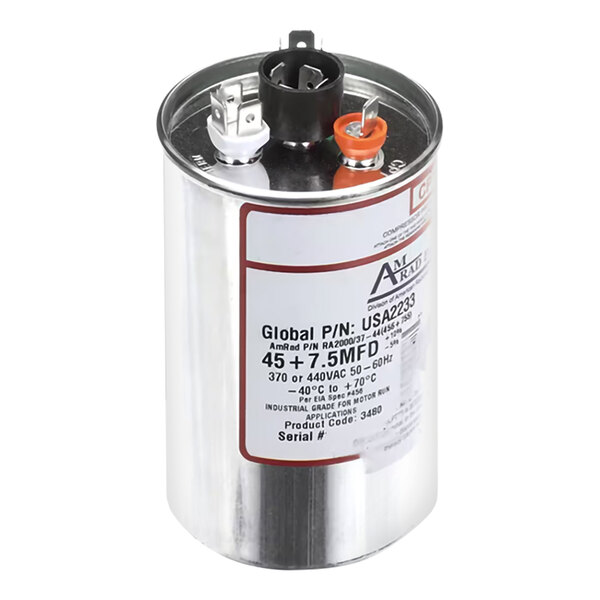 A cylindrical metallic capacitor with three terminal connectors on top and a label displaying technical specifications.
