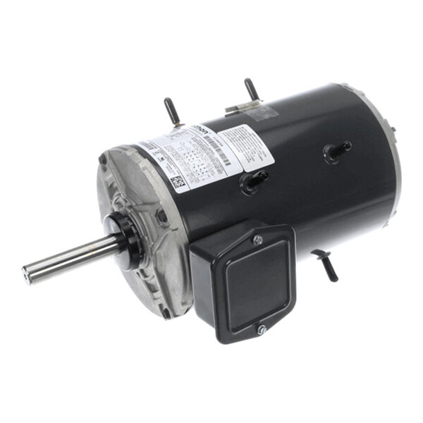 A cylindrical electric motor with a protruding metal shaft, black housing, and attached label with technical specifications.