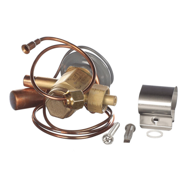 A collection of metal and brass components, including coiled copper tubing, a valve, and mounting hardware, arranged on a white background.