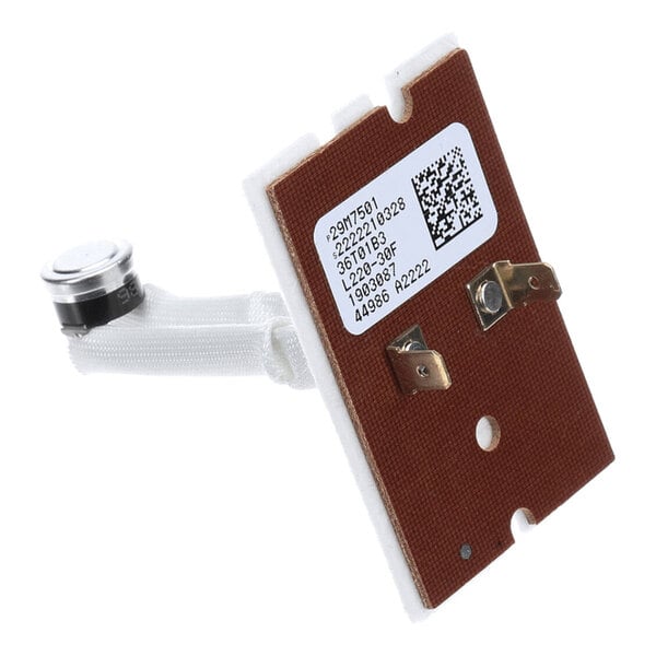 A rectangular electronic component with a brown circuit board, two metal terminals, a white label with printed text and a QR code, and a cylindrical metal sensor attached by a white insulated wire.