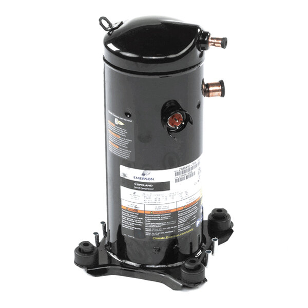 A black cylindrical mechanical component with copper pipe fittings and a label, mounted on a metal base.