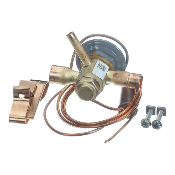 A brass and copper mechanical valve assembly with attached coiled tubing, a metal mounting clip, and two screws, all placed on a white background.