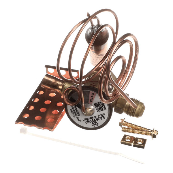 A coiled copper tube assembly with a brass fitting, a perforated copper mounting bracket, screws, and a small white zip tie.