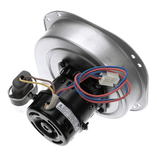 A metal combustion air blower assembly with attached motor, wiring, and mounting plate.