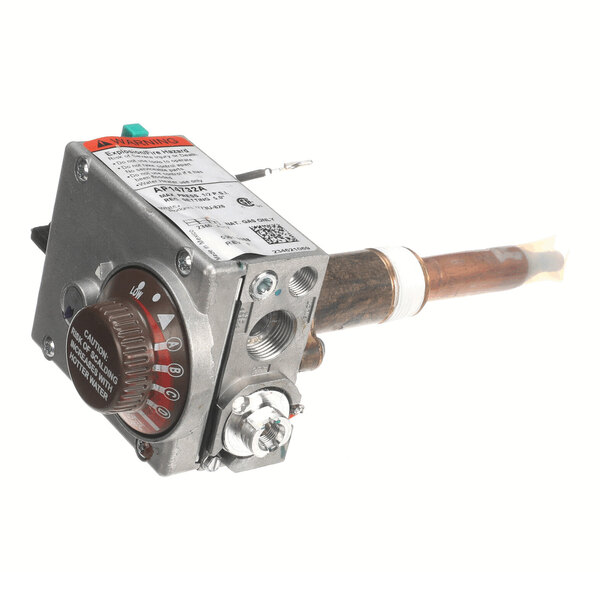 A metal device with a dial, labeled settings, and a copper tube extending from one side, likely a thermostat or control valve component.