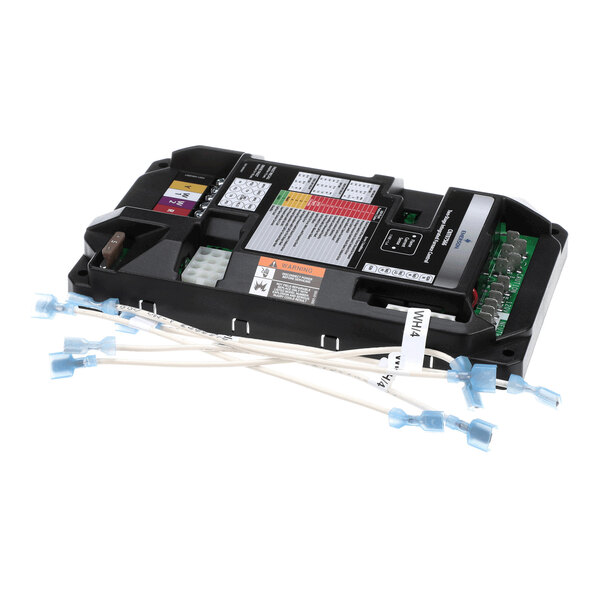 A black electronic control module with multiple colored labels, terminal connections, and attached white wires with blue connectors.