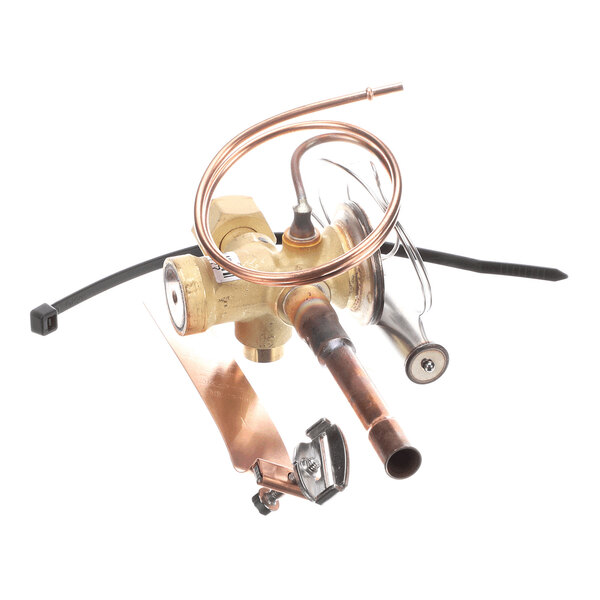 A brass and copper mechanical valve assembly with coiled tubing and attached metal components, photographed on a white background.