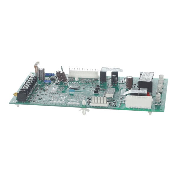 A green electronic circuit board with various capacitors, connectors, and relays mounted on it.