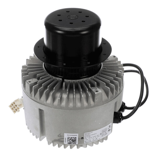 A cylindrical metallic component with a finned body, black top cover, and attached electrical wires, likely part of an industrial or HVAC system.