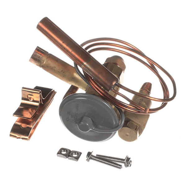 A collection of copper and metal components, including coiled tubing, a round metallic part, a clamp, and screws, arranged together on a white background.